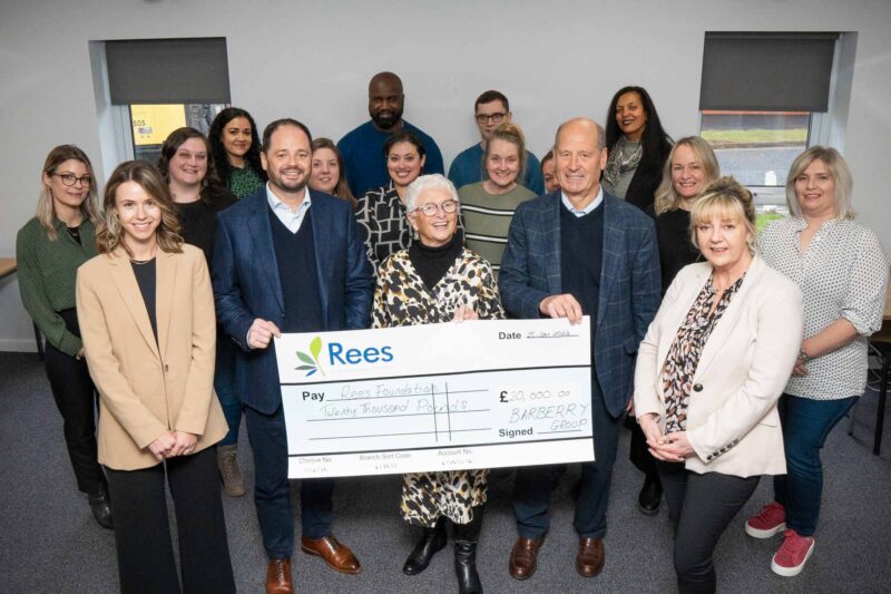 Barberry presenting a cheque to the Rees Foundation charity